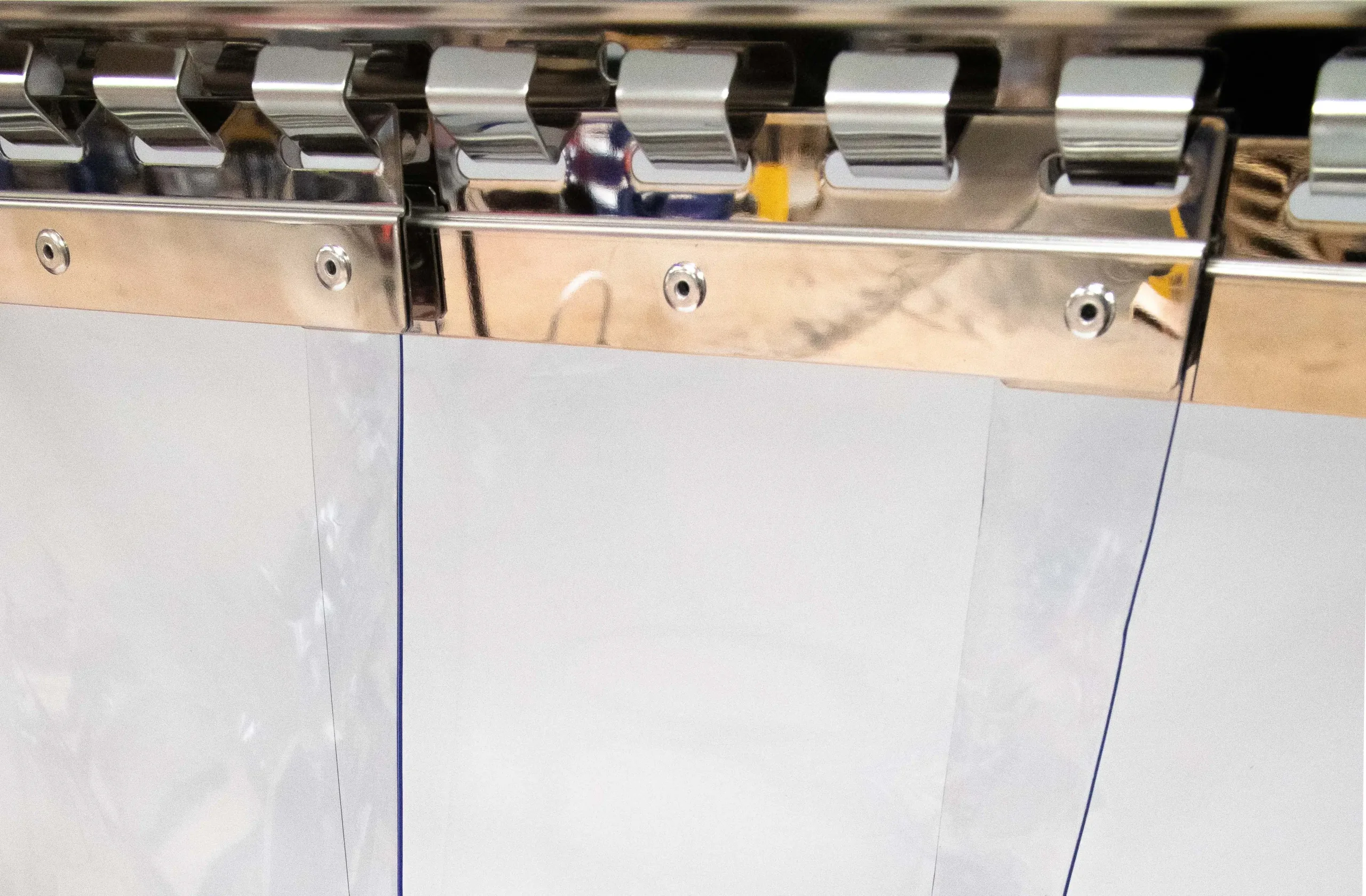 Pvc Strip Curtain zoomed in on to the plates and hanging rails
