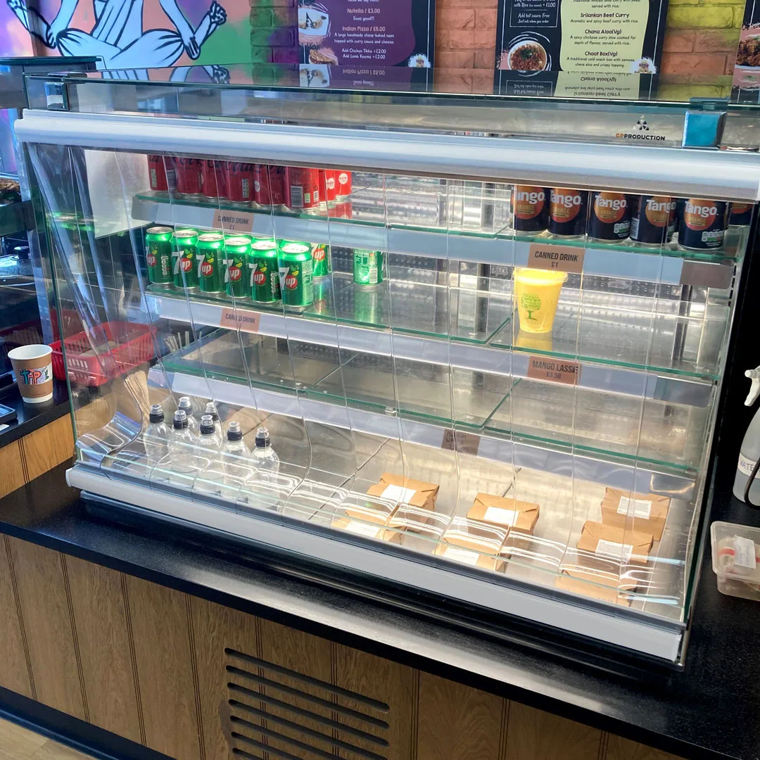 Chiller blind by a shops counter fridge with drinks and food in it